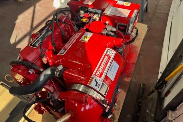 Slide: The Image of Red engine of a 2007 Pursuit OS 335 Offshore boat, detailed view. - 24