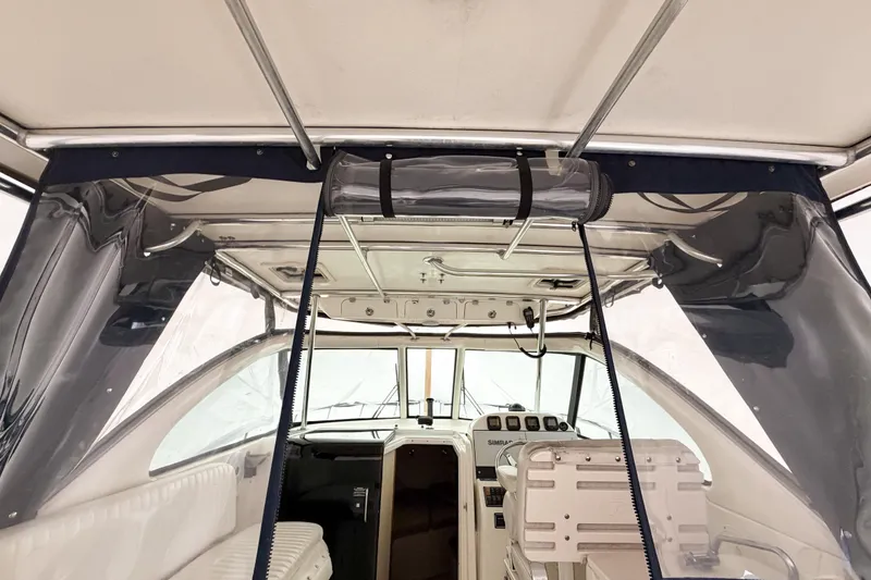 Slide: The Image of 2007 Pursuit OS 335 Offshore boat interior with helm and seating area. - 6