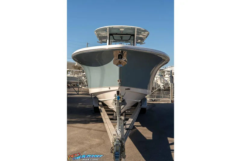 Slide: The Image of 2026 Sea Hunt Ultra 285 Coffin Box boat on trailer, front view. - 10