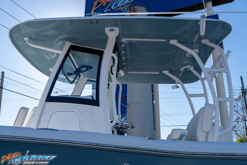 Slide: The Image of 2026 Sea Hunt Ultra 285 Coffin Box boat with T-top and seating. - 11