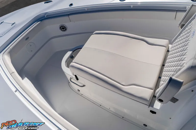 Slide: The Image of 2026 Sea Hunt Ultra 285 Coffin Box boat interior with cushioned seating. - 22