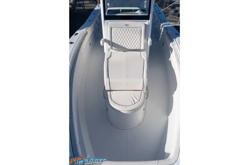 Slide: The Image of 2026 Sea Hunt Ultra 285 Coffin Box boat interior with white seating and sleek design. - 23