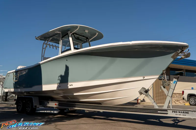 Slide: The Image of 2026 Sea Hunt Ultra 285 Coffin Box boat on trailer, displayed outdoors. - 9