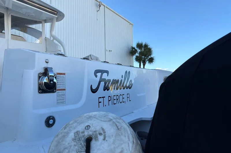 Slide: The Image of 2020 Pursuit DC 365 Dual Console boat with "Famille" name, Ft. Pierce, FL. - 21