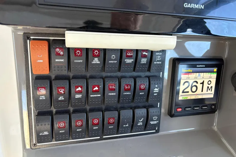 Slide: The Image of 2020 Pursuit DC 365 Dual Console boat seat with beige and gray upholstery. - 6