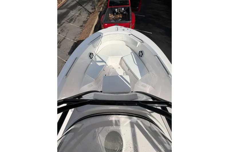 Slide: The Image of 2024 Aquasport 2100 Center Console boat interior with seating and storage compartments. - 12
