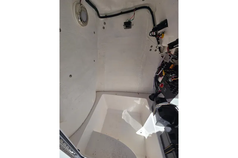 Slide: The Image of Interior view of 2024 Aquasport 2100 Center Console boat wiring and components. - 21