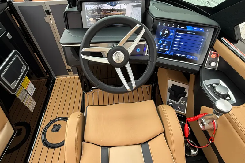Slide: The Image of 2025 MasterCraft X24 boat cockpit with modern steering wheel and digital dashboard. - 7