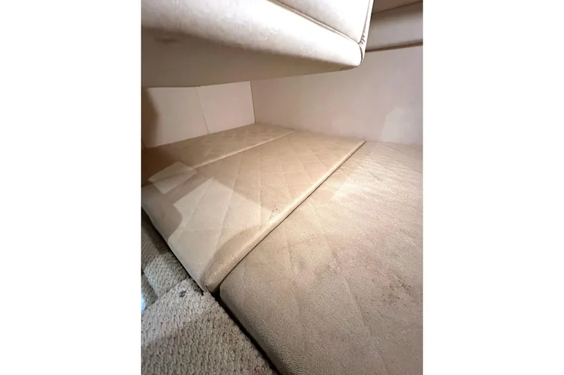 Slide: The Image of Interior cabin of 2007 Sea Ray Sundancer 260 with beige upholstery. - 13