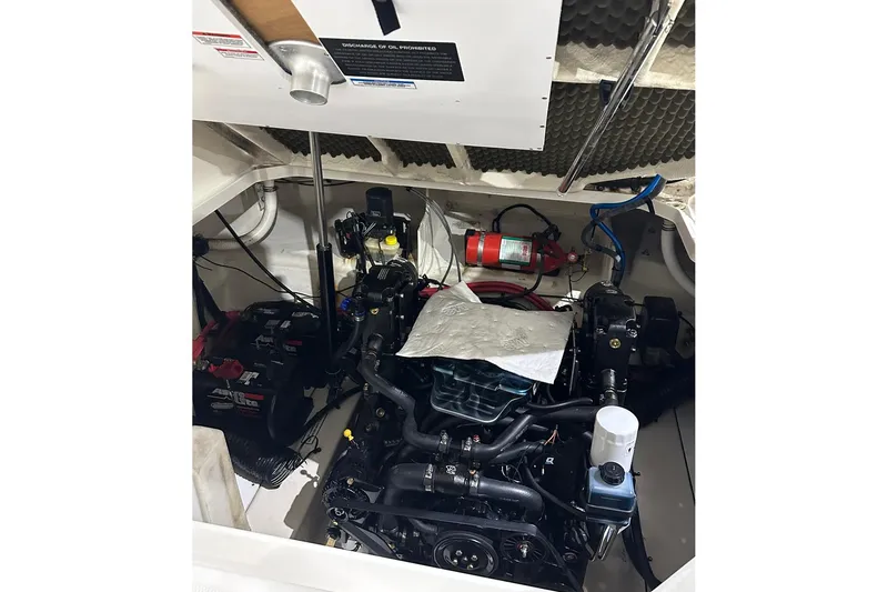 Slide: The Image of Engine compartment of a 2007 Sea Ray Sundancer 260 boat, featuring detailed components. - 16