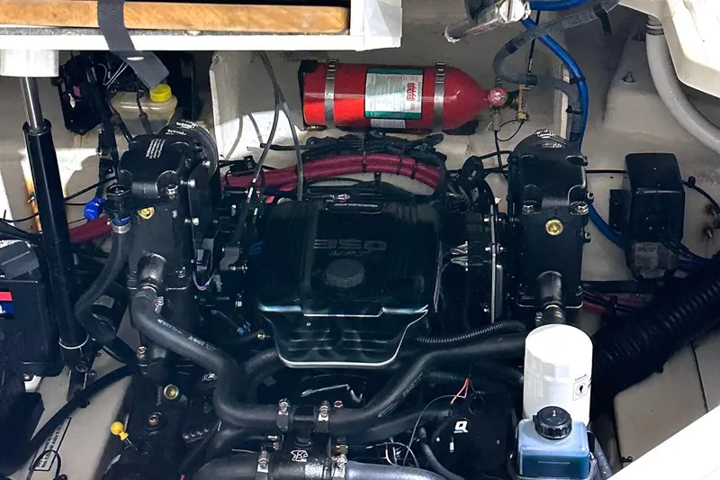 Slide: The Image of Engine compartment of a 2007 Sea Ray Sundancer 260 boat, featuring a 350 engine. - 18