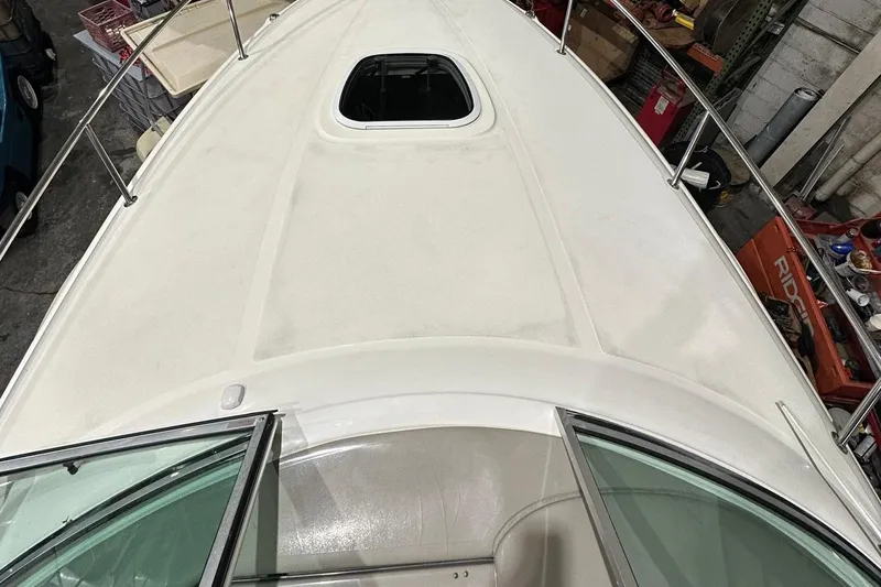 Slide: The Image of 2007 Sea Ray Sundancer 260 boat deck with open hatch, viewed from above. - 3