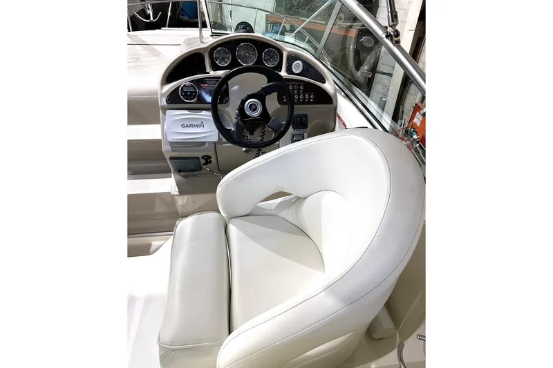 Slide: The Image of Captain's seat and dashboard of a 2007 Sea Ray Sundancer 260 boat. - 4