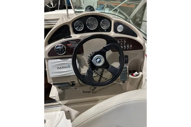 Slide: The Image of 2007 Sea Ray Sundancer 260 helm with Garmin navigation and classic instrument panel. - 5