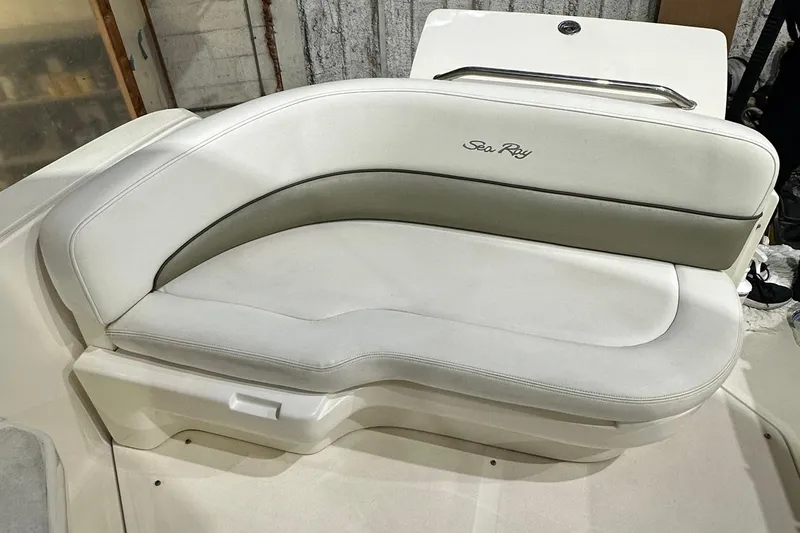 Slide: The Image of 2007 Sea Ray Sundancer 260 boat seating, featuring white and gray upholstery. - 8