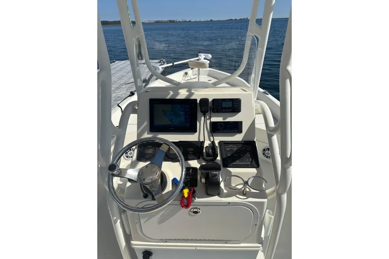 Slide: The Image of 2016 Skeeter SX2250 boat on trailer, viewed from below, showcasing hull and tire. - 10