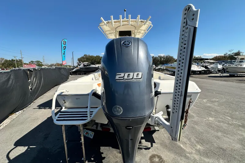 Slide: The Image of 2016 Skeeter SX2250 boat with Yamaha 200 engine, parked outdoors. - 15