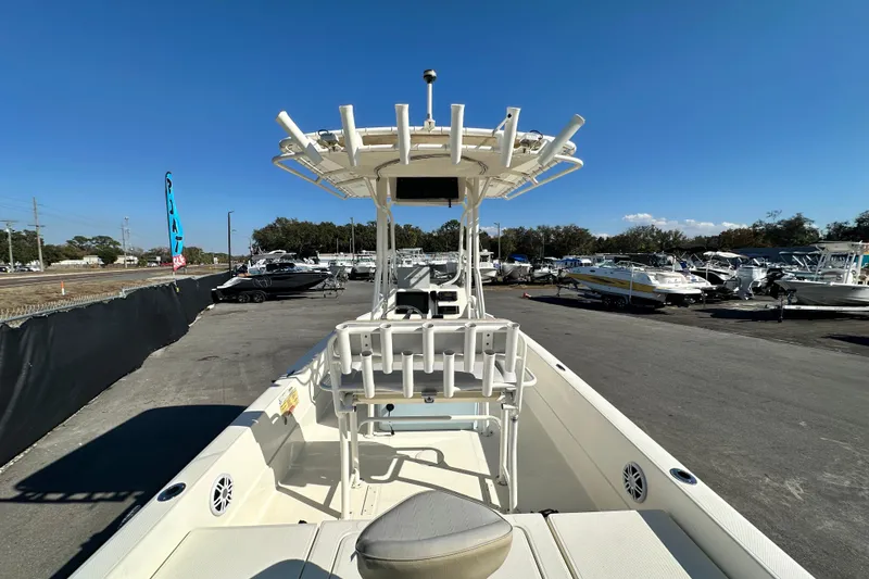 Slide: The Image of 2016 Skeeter SX2250 boat displayed in a marina under clear blue skies. - 18