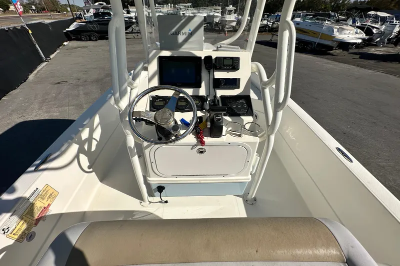 Slide: The Image of 2016 Skeeter SX2250 boat console with steering wheel and navigation equipment. - 27