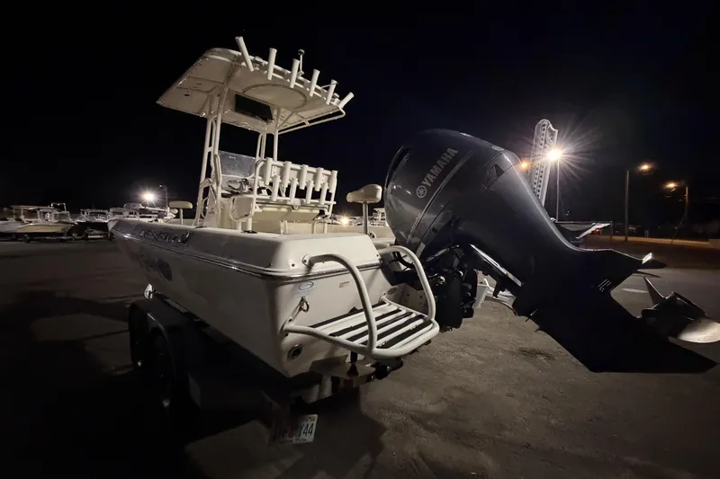 Slide: The Image of 2016 Skeeter SX2250 boat on trailer, displayed outdoors under clear blue sky. - 3