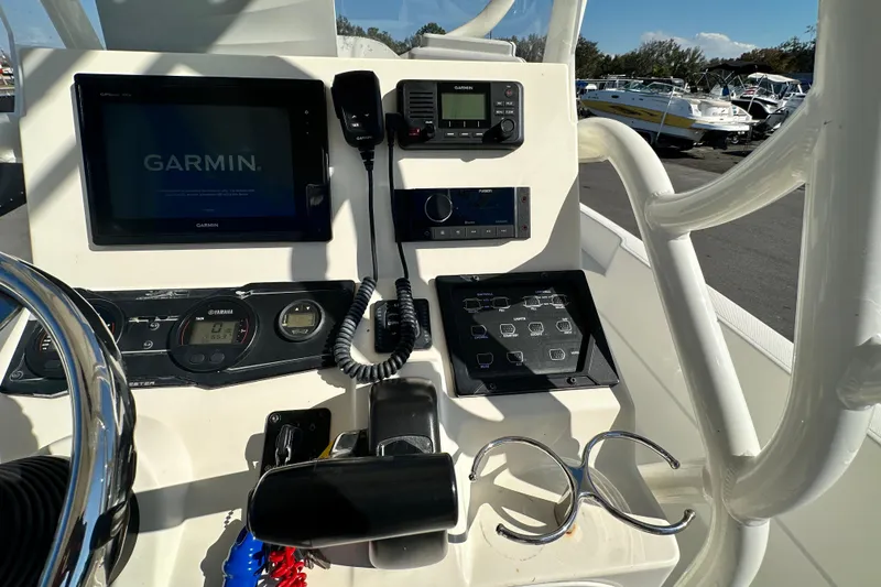 Slide: The Image of 2016 Skeeter SX2250 boat dashboard with Garmin navigation system and controls. - 34