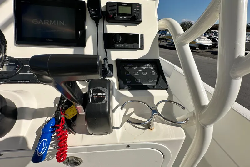 Slide: The Image of 2016 Skeeter SX2250 boat console with Garmin GPS, Yamaha controls, and cup holders. - 38