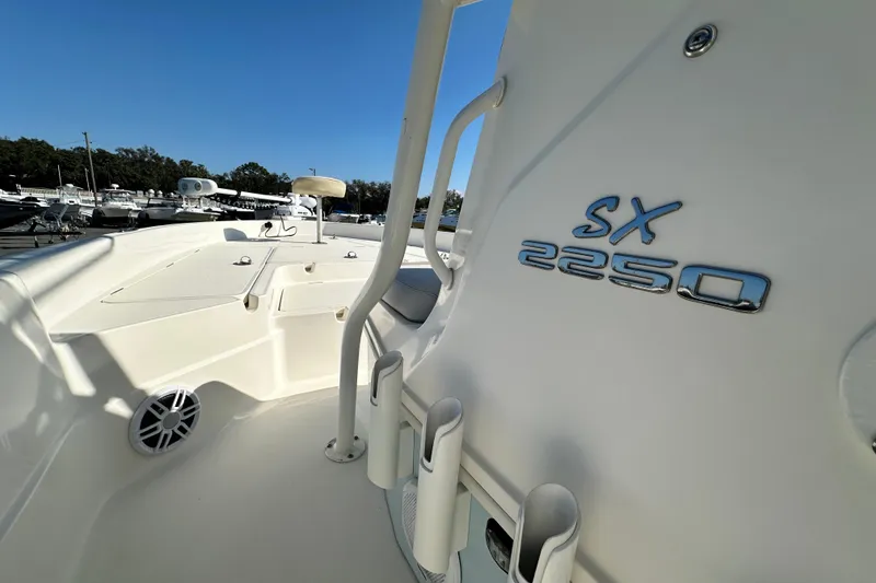 Slide: The Image of 2016 Skeeter SX2250 boat interior with rod holders and logo. - 44