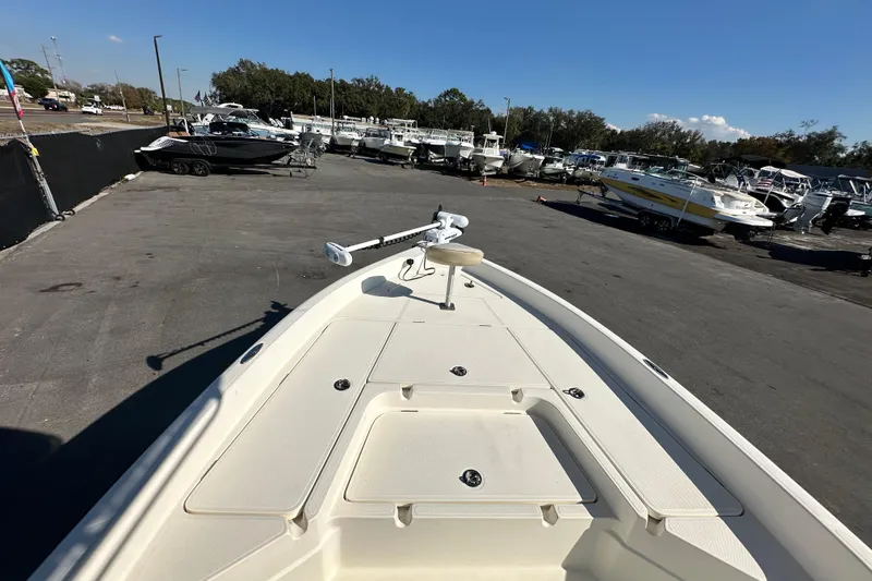 Slide: The Image of 2016 Skeeter SX2250 boat in a marina, surrounded by various other boats. - 46