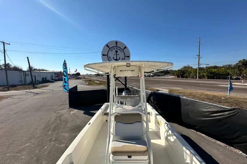 Slide: The Image of 2016 Skeeter SX2250 boat displayed outdoors under clear blue sky. - 58