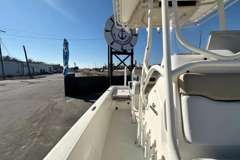 Slide: The Image of 2016 Skeeter SX2250 boat parked near a nautical-themed sign on a sunny day. - 66