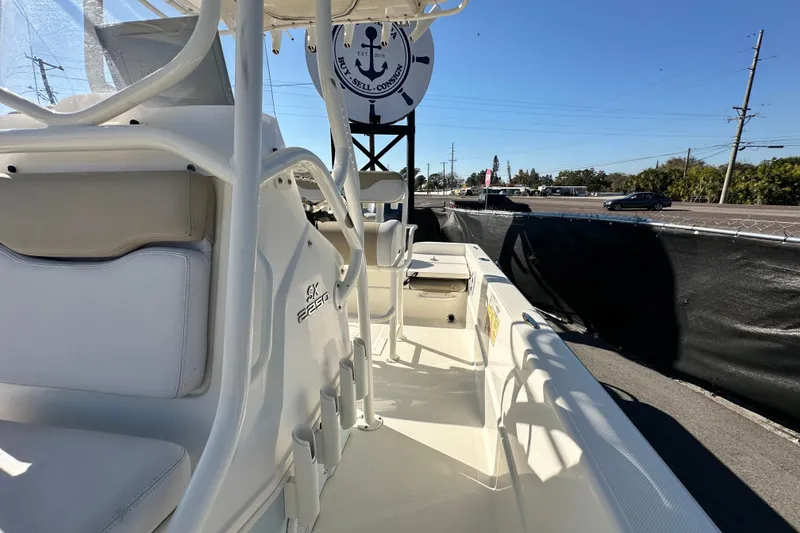 Slide: The Image of 2016 Skeeter SX2250 boat interior with seating and console, displayed outdoors. - 67