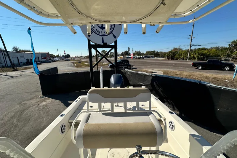 Slide: The Image of 2016 Skeeter SX2250 boat interior view with seating and steering wheel. - 68