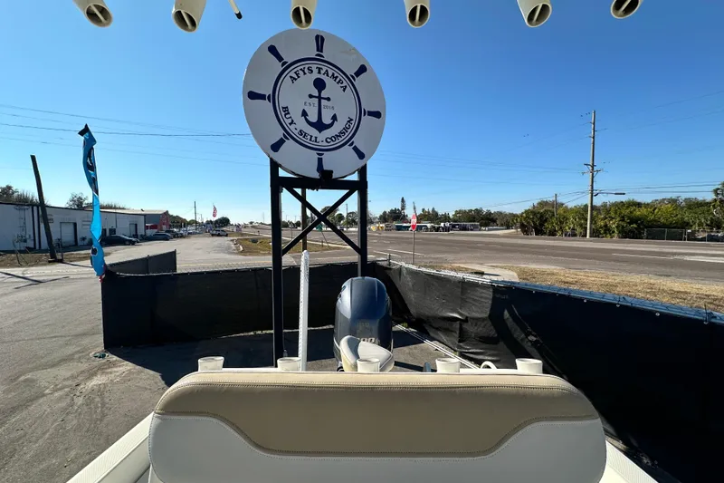 Slide: The Image of 2016 Skeeter SX2250 boat at dealership with "Buy, Sell, Consign" sign. - 69