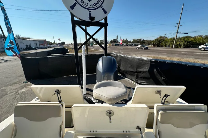 Slide: The Image of 2016 Skeeter SX2250 boat with Yamaha outboard motor, parked near a road. - 73