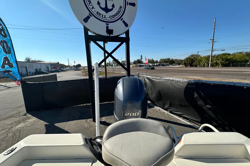 Slide: The Image of 2016 Skeeter SX2250 boat with 200 horsepower engine displayed outdoors. - 74