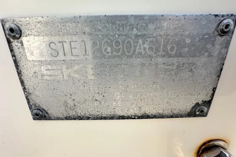 Slide: The Image of 2016 Skeeter SX2250 identification plate with serial number, showing wear and corrosion. - 80
