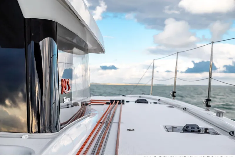 Slide: The Image of 2022 Excess 11 yacht on open sea with cloudy sky background. - 18
