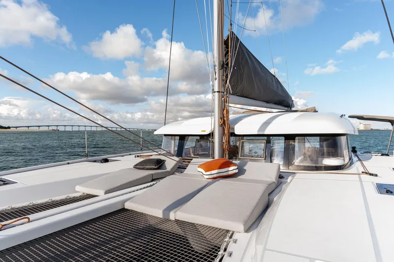 Slide: The Image of 2022 Excess 11 catamaran on open water, featuring spacious deck and modern design. - 19