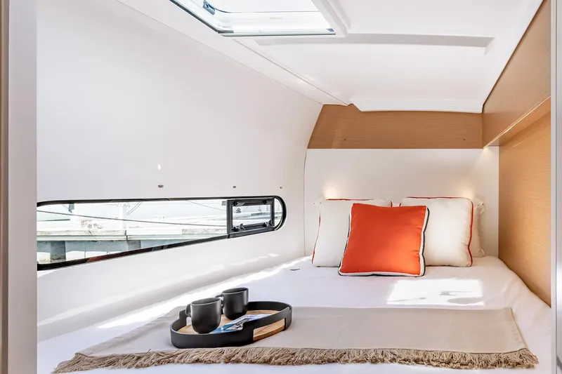 Slide: The Image of Cozy cabin interior of 2022 Excess 11 yacht with pillows and tray. - 22