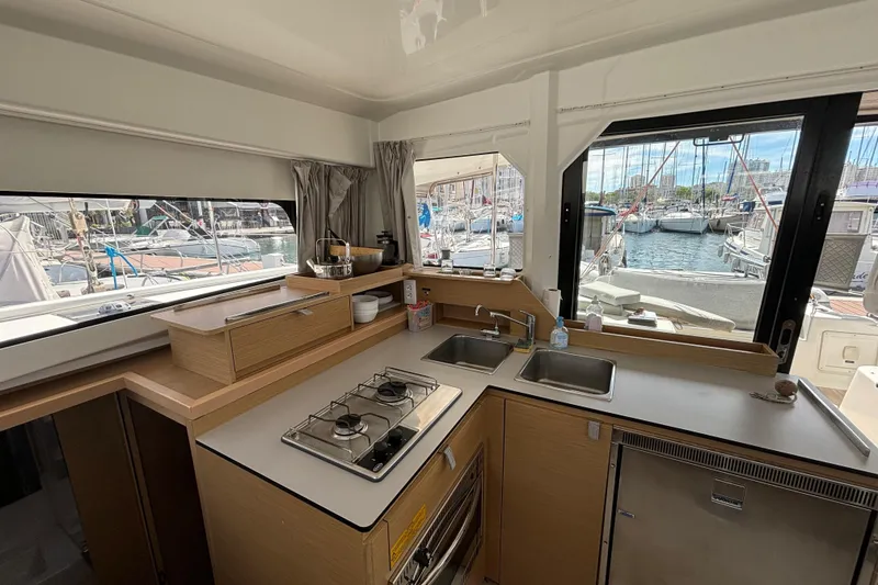 Slide: The Image of Modern kitchen in 2022 Excess 11 yacht with marina view through windows. - 29