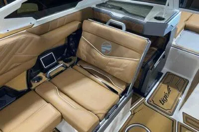 Slide: The Image of 2026 Tigé Ultré 25ZX boat interior with luxurious tan leather seating and modern design. - 12