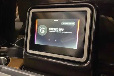 Slide: The Image of Touchscreen display in 2026 Tigé Ultré 25ZX boat, showing stereo off message. - 15