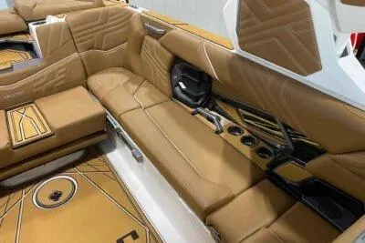 Slide: The Image of 2026 Tigé Ultré 25ZX boat interior with luxurious tan leather seating and modern design. - 16