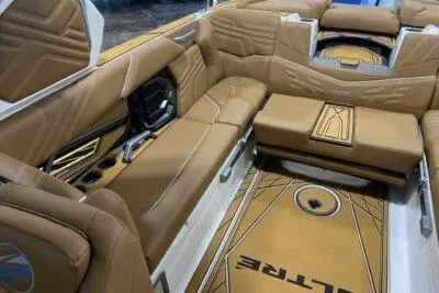 Slide: The Image of 2026 Tigé Ultré 25ZX boat interior with luxurious tan seating and stylish design. - 17