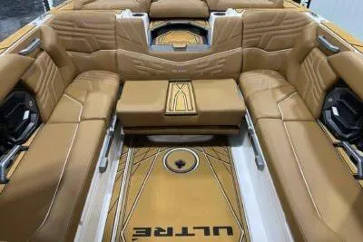 Slide: The Image of 2026 Tigé Ultré 25ZX boat interior with luxurious tan seating and modern design. - 18