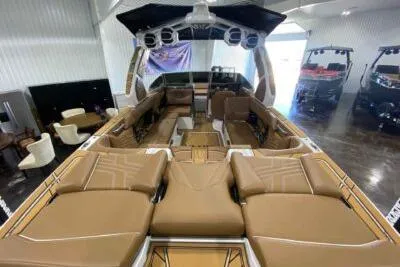 Slide: The Image of 2026 Tigé Ultré 25ZX boat interior with luxurious brown seating and modern design. - 8