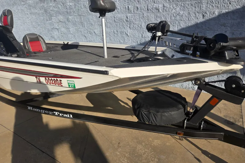 Slide: The Image of 2017 Ranger RT188 boat on trailer, featuring Minn Kota trolling motor. - 4