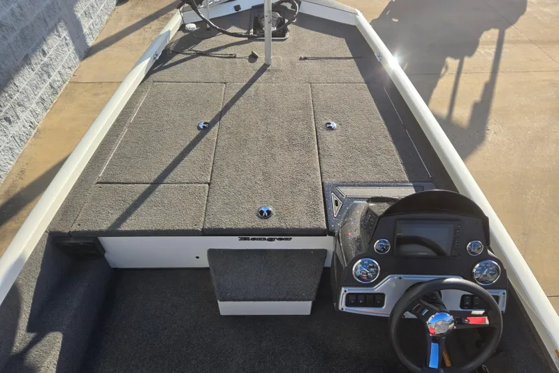 Slide: The Image of 2017 Ranger RT188 boat interior with steering console and carpeted deck. - 6