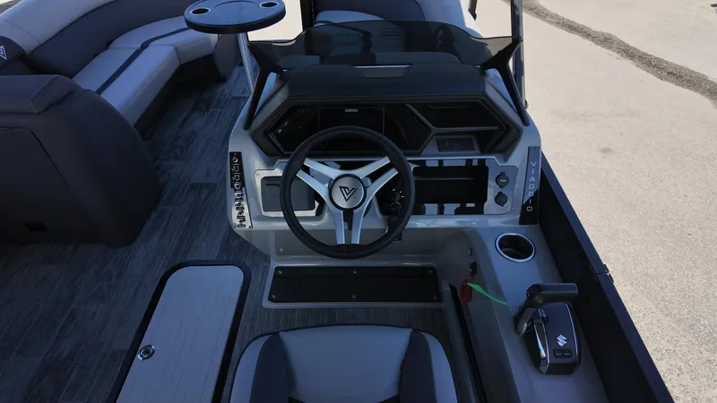 Slide: The Image of 2025 Viaggio X22S boat cockpit with modern steering wheel and controls. - 9