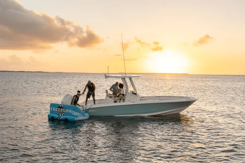 Slide: The Image of Boston Whaler 250 Dauntless 2026 at sunset on the sea. - 30
